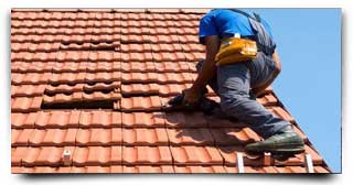 Roofer Repairing Roof